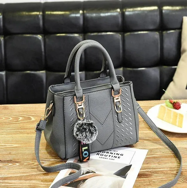 Elegant Structured Satchel with Pom-Pom Detail